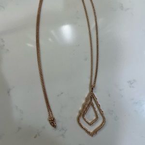 Kendra Scott rose gold long necklace.